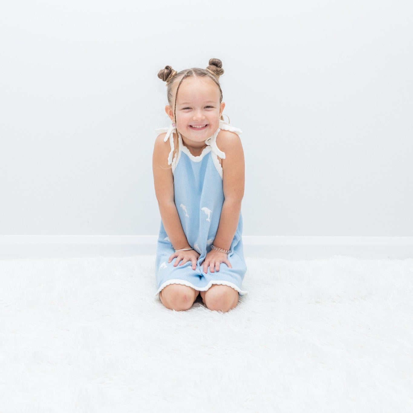 Girl in dolphin knit sun dress - Dad Dressed Me Just Keep Swimming kids dress Australia