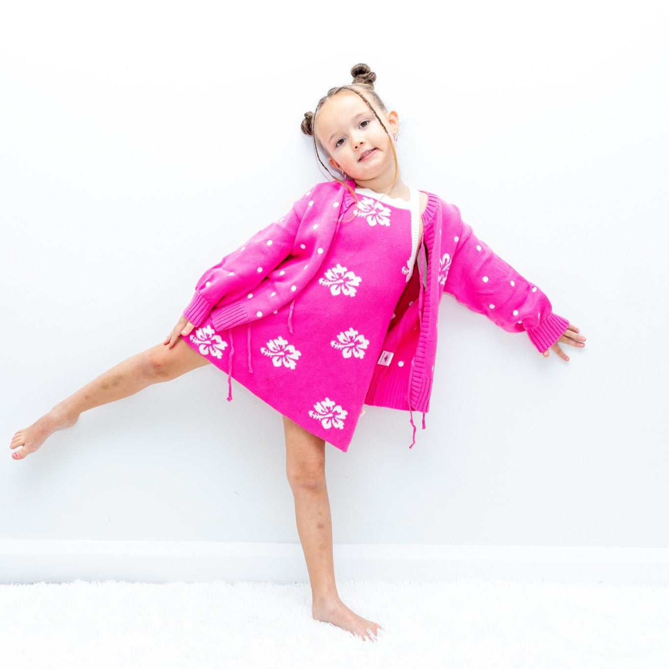 Girl wearing pink hibiscus flower tie-up cardi - Dad Dressed Me matching kids knitwear