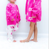 Two sisters in matching pink tie-up cardigans - Dad Dressed Me Tropical Trip kids clothing Australia