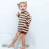 Toddler wearing the Wish Upon a Star Romper in brown and cream stripes