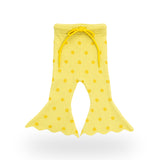 Buttercup Flares in buttery yellow knit with gold spots – front