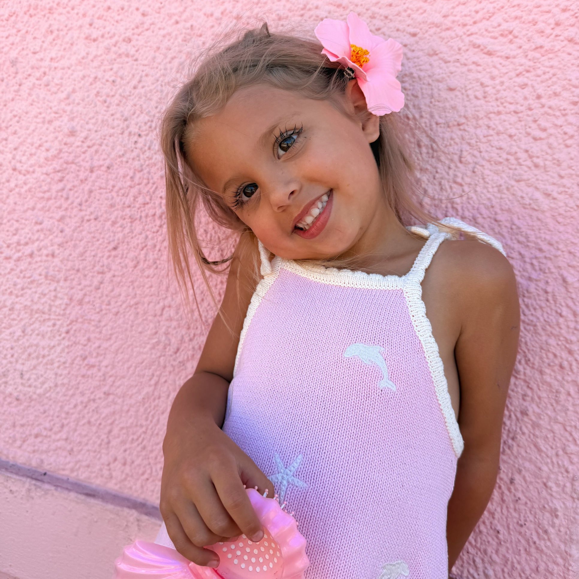 Embroidered dolphin and starfish detail on pink knit sun dress
