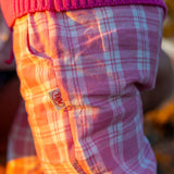 Little Dolphin Club Pants in pink check, detail of the side pocket, drawstring waist and Dad Dressed Me woven tag