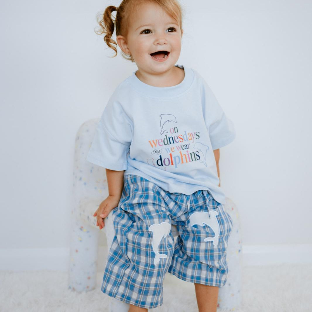 Kid in Little Dolphin Club Tee — cool kidswear