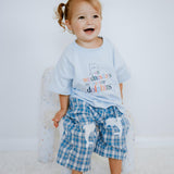 Kid in Little Dolphin Club Tee — cool kidswear