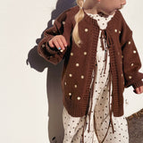 Daisy Dot Jumpsuit layered under the Honey Blossom Cardi