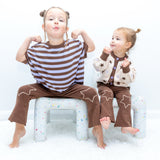 Two children wearing the Starry Flare Pant with Star Gazer tops