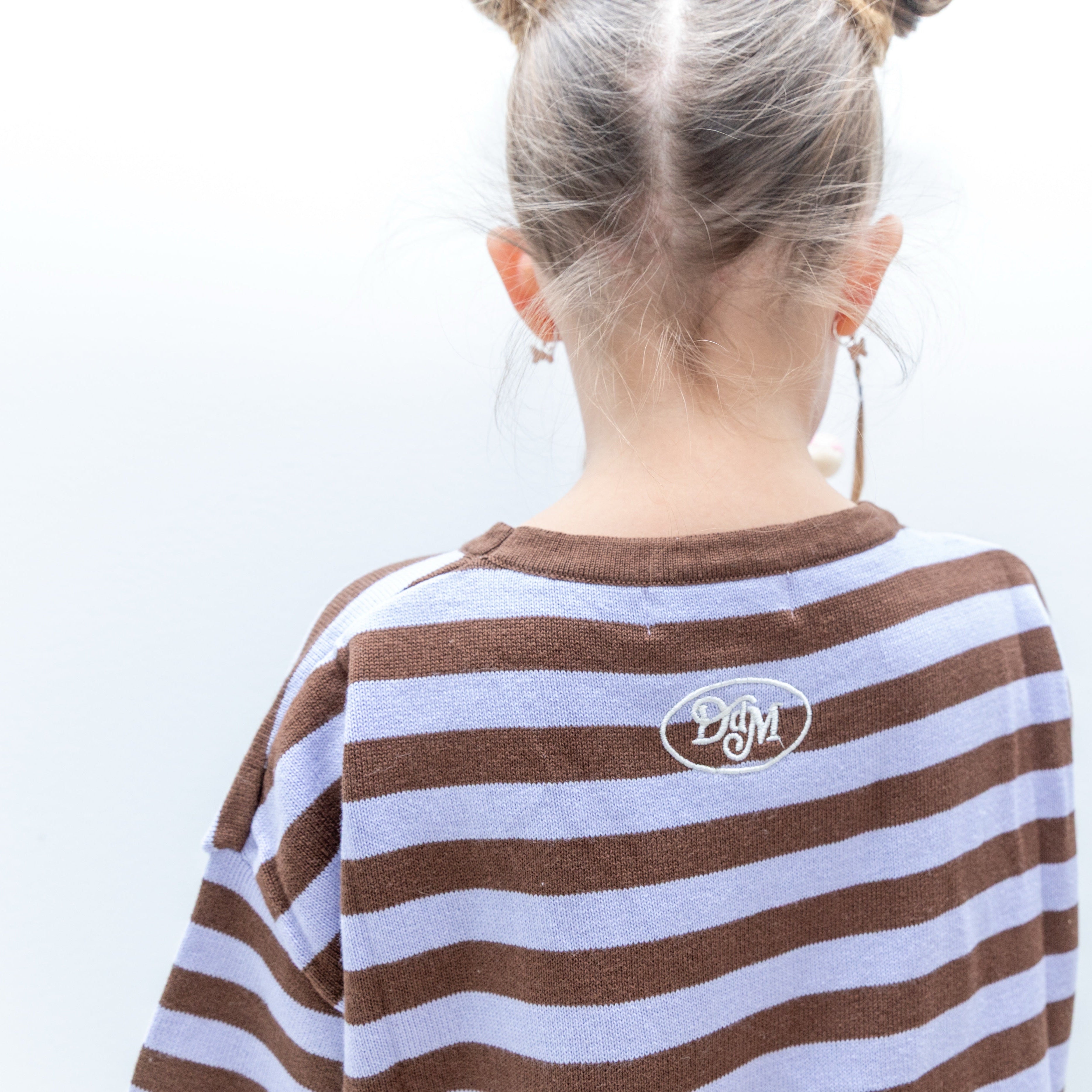 Back of the Cosmic Tee showing the embroidered DDM logo